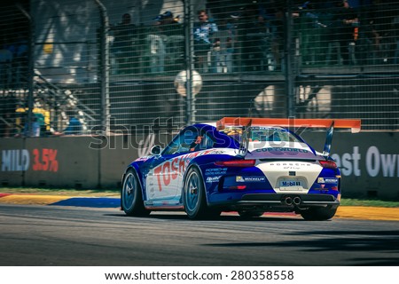 Adelaide, South Australia - March 01, 2014: Porsche GT3 racing car is driving on the racing track at Clipsal 500 V8 Supercars