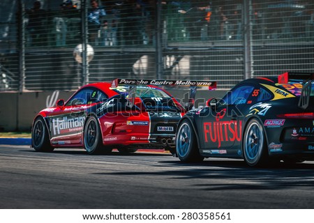Adelaide, South Australia - March 01, 2014: Porsche GT3 racing cars are competing on the racing track at Clipsal 500 V8 Supercars