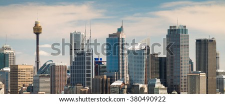 Panoramic view at Sydney city urban skyline from Western Plains with blue sky and clouds on a bright day