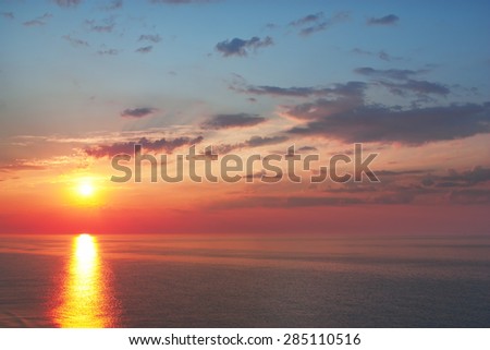 beautiful sunrise over the quiet calm sea