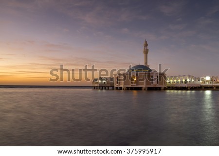 The Floating Mosque in Jidda, Saudi Arabia taken during sunset with slow shutter. Motion blur soft focus due to slow shutter speed. Copy Space Area.