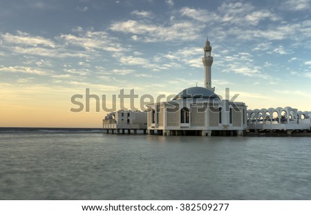 Ar Rahmah mosque by the red sea in Jeddah, Saudi Arabia. Taken using long exposure. Motion blur were due to slow shutter speed. Copy space area.