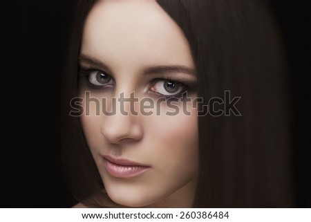 Beauty natural face model with smoky eyes makeup and hair style