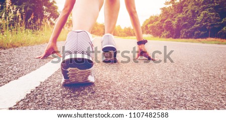 Start of people  running on street,with sunset light.Goal of Success