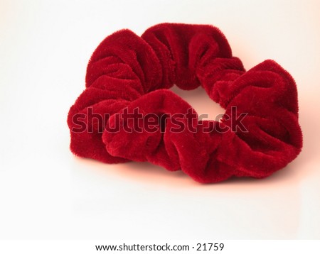 stock photo Red Velvet'hair scrunchy' used to hold a pony tail