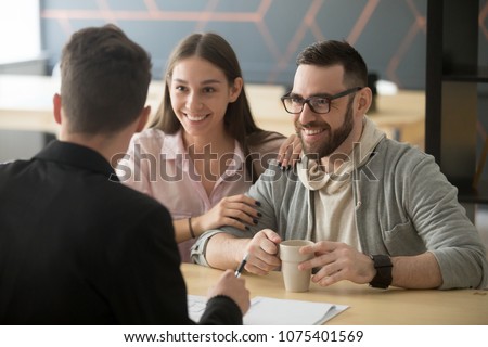 Realtor, bank worker, insurance broker or financial advisor consulting smiling millennial couple, happy clients customers planning mortgage investment, real estate rent purchase, taking loan concept