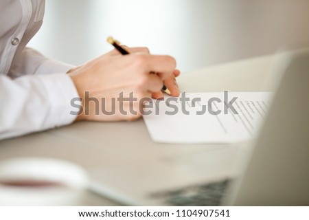 Businesswoman signing paper, female hand puts signature on business document making employment contract agreement, taking bank loan insurance concept, patent certificate registration, close up view