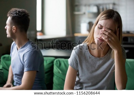 Tired frustrated wife feeling sad after couple fight with stubborn husband, upset millennial woman depressed and disappointed in marriage avoiding boyfriend fed up with debts and problems concept
