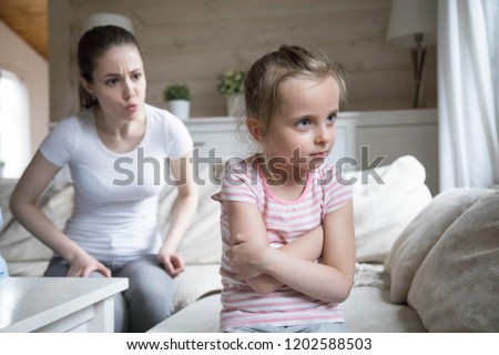 Woman scolding little girl. Millennial mother screaming shouting to small preschool daughter. Complicated relations between mom and kid, misunderstanding conflict in family or child punishment concept