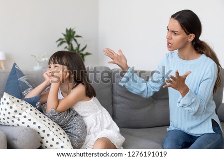 Angry annoyed mom shouting scolding for discipline lecturing stubborn kid ignoring not listening to mother, strict single mum talks to rebellious child reprimanding little disobedient fussy daughter