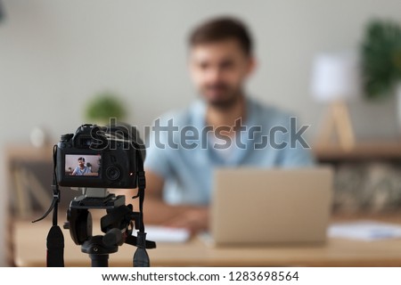 Digital camera filming commercial video blog or vlog of man teacher vlogger coach youtuber recording business course class or presentation training, device shooting videoblog youtube vlogging concept