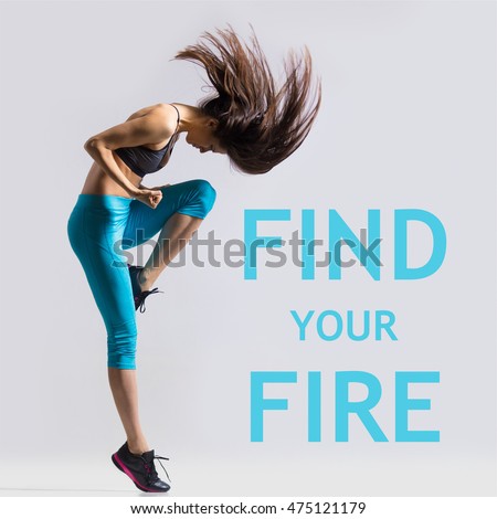 Beautiful young fit modern dancer lady in blue sportswear warming up, working out, dancing with her long hair flying, full length, studio image on gray background. Motivational phrase \