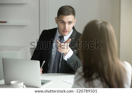 Two business people having a dialogue between, intended to reach a beneficial outcome; man from human resource management interviewing a lady; boss scolding his worker. Business concept photo