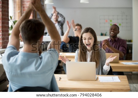 Excited woman looking at laptop screen surprised by good online news win achievement, corporate team colleagues congratulating coworker with business success clapping hands in coworking shared office