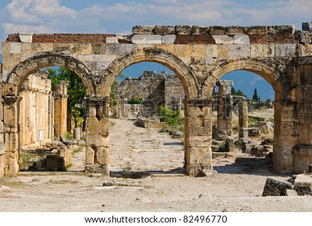 the ruins of the ancient city of Hierapolis on the hill Pamukkale, Turkey. Symbol of broken civilisation
