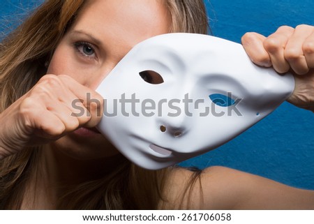 angry female face semi covered with white mask
