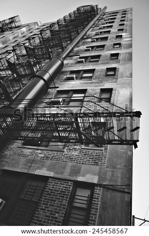 Looking up an apartment building in Chicago in black and white photography.