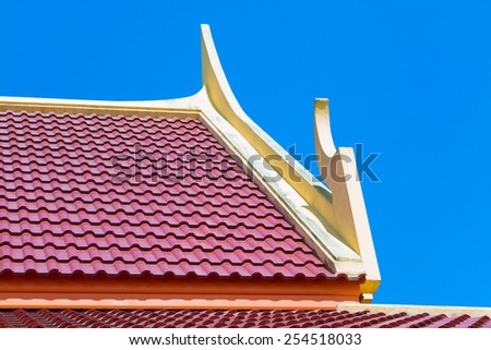 Red corrugated metal sheets roofs
