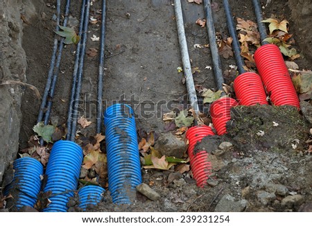 Plastic pipes containing electric cables in the ground