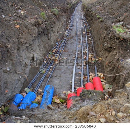 Plastic pipes containing electric cables/wires in the ground