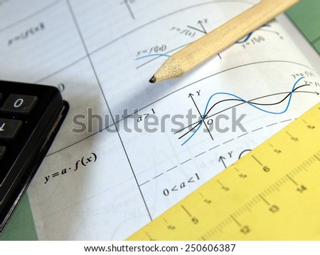 Exam, test study of mathematics (book, pencil, measure, calculator) - Background shows trigonometry formulas ans sinus graph