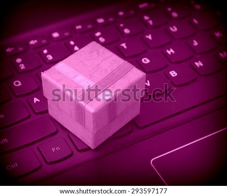 Web shopping / Internet shopping -  gift box on the black laptop keyboard