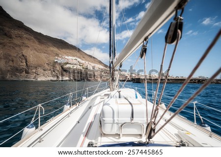 Sailing boat deck with set sails, Tenerife Spain