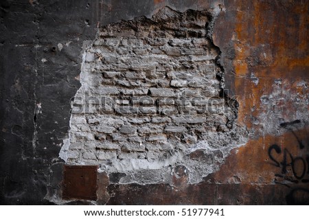 fallen mortar exposing moldy bricks