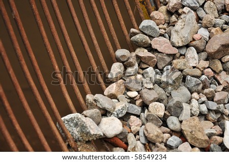 iron mesh with gravel close up