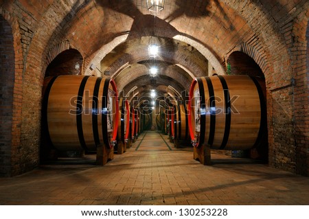 Old Wine Barrels In The Vault Of Winery