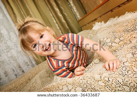 Little blond smiling girl (facial portrait)