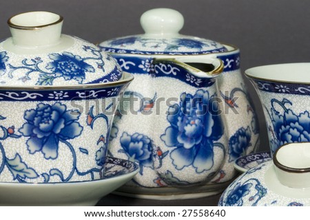 A n antique tea set with an asian motif