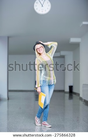 girl posing in school hall