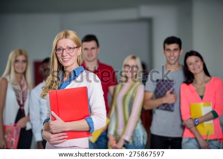 profesor in front of students in school hall
