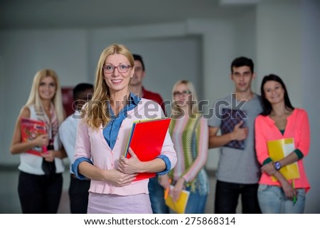 profesor in front of students in school hall