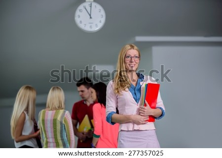 teacher in front of students in school hall