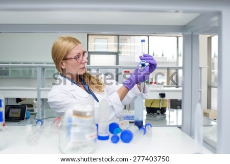 doctor in lab examines the chemical compounds