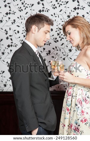 Young couple in love making a toast