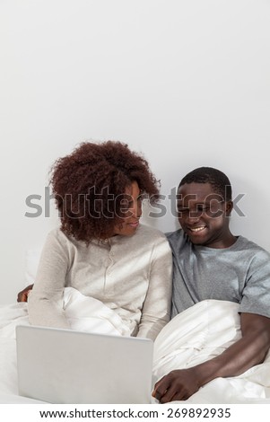 Couple in love have fun using the computer