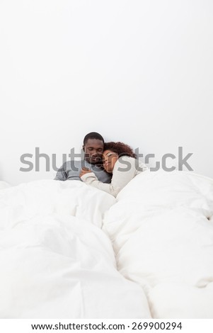 Black couple in love in the bed