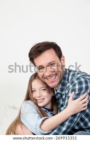 Father and daughter giving himself a hug