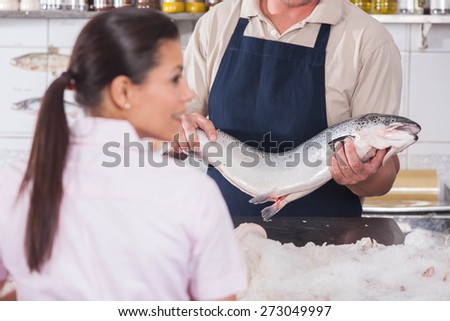 Man selling a pink salmon