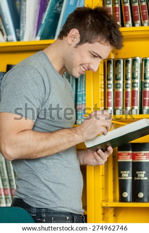 Guy studying with a book