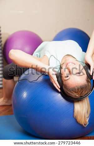 Woman listen to music in yoga class