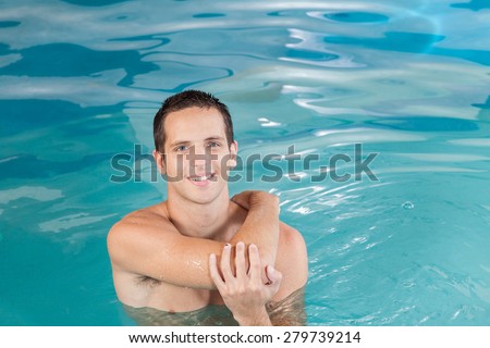 Athletic guy inside the pool
