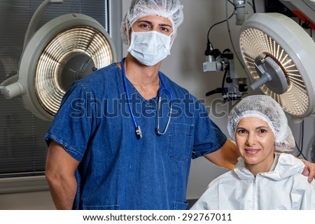 Doctor and patient looking at camera