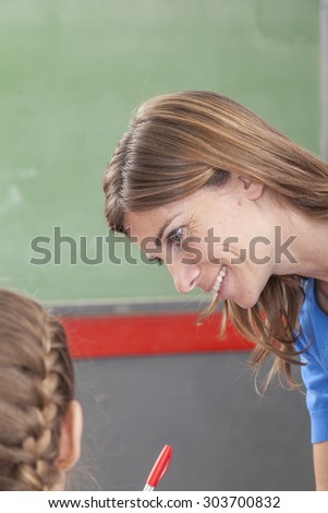 The teacher checking the homework