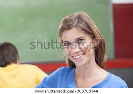 The teacher looking at camera