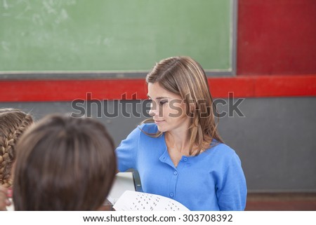 Teacher giving the exam