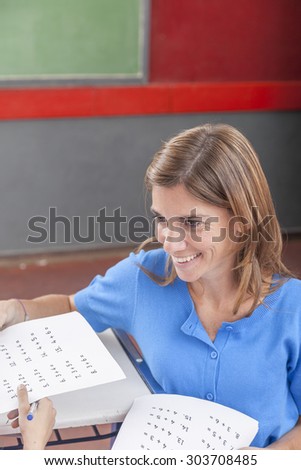 Teacher giving the exam